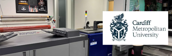 Image of the Cardiff Metropolitan University print room showing Konica Minolta devices and the university logo